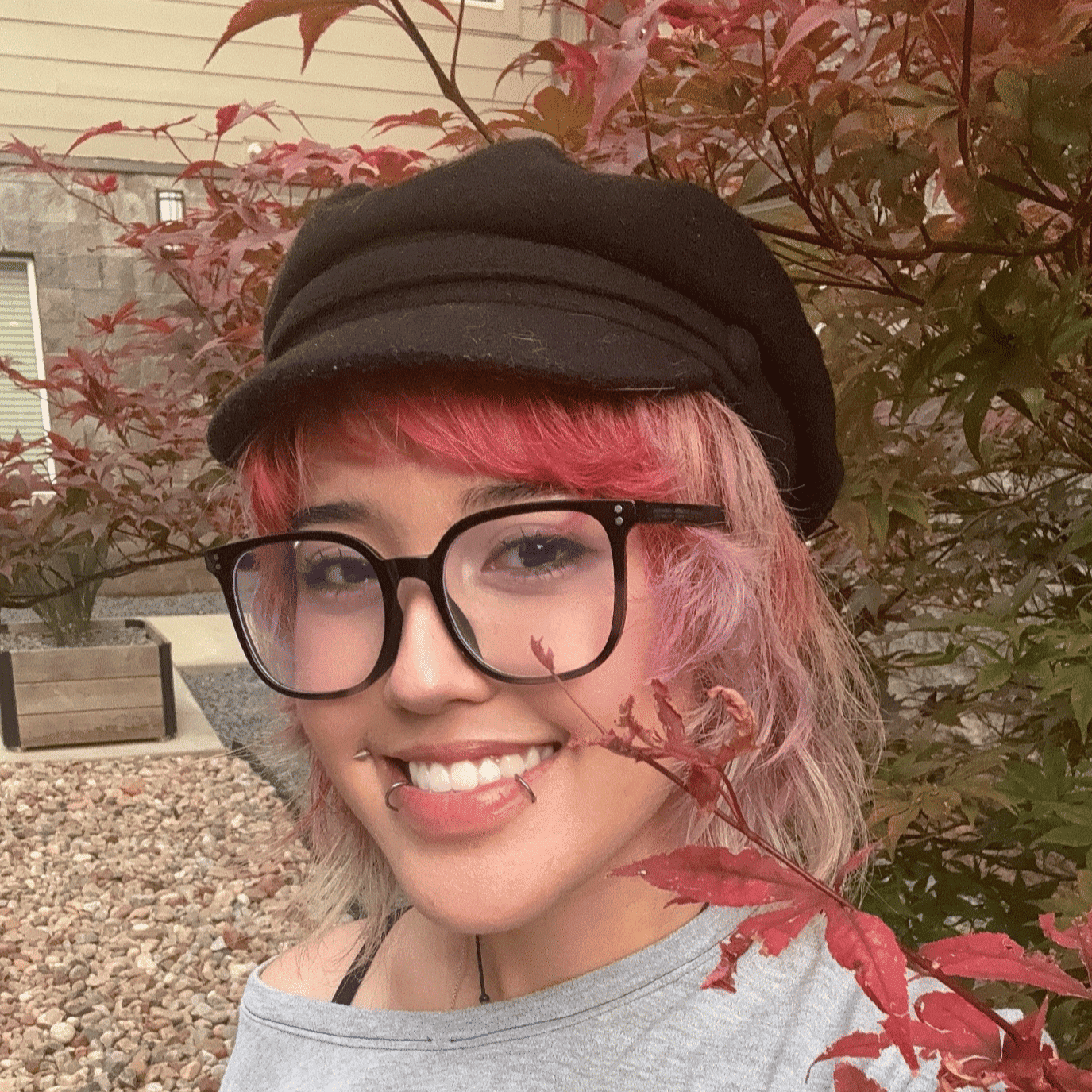 Portrait of Anh Tran, a professional stylist at Salon Wave, showcasing their expertise and style.